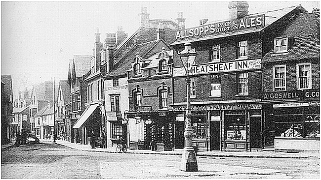 This is a view from Market Place looking down Denmark Street. The Wheatsheaf Inn is an early 19th century building. As can be seen it was not tied to a brewery, selling both Allsopps Ales and Stollery Brothers wines and spirits.