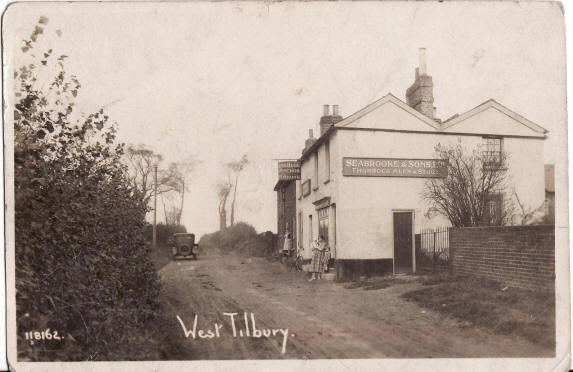 Blue Anchor, West Tilbury - circa 1900 - The picture shows Florence Hunt in the rear doorway and her niece Violet Ashdown outside the Blue Anchor pub, with two of her children.  You can see F.A Hunt over the door.