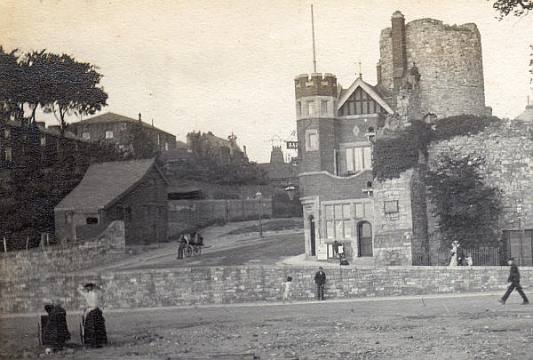 The tower is the Arundel tower on the town walls of Southampton. The tower still exists but not the Victorian pub at its base; which must be the �Arundel Tower� pub, listed at 22 Bargate Street