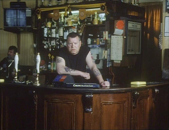 Warren Clarke as the landlord in the Rock (in the film ID),  in 1995