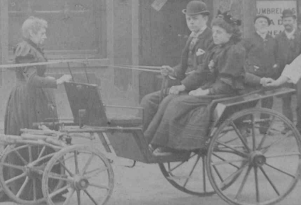 In the photo is my Great Grandmother, standing and facing her nephew (the deceased Charles Winder's son) and her daughter (seated in the carriage), my Grandmother.