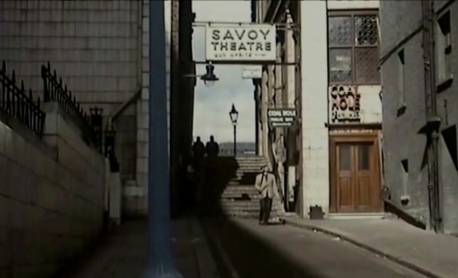 'The London Nobody Knows 1967' – James Mason walks down a path at the side of the Savoy - past a pub called the Coal Hole public bar.
		