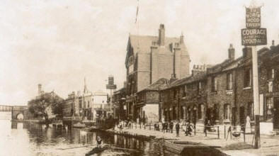 The canal side at Clapton in around 1905. The most prominent building is the Beehive - the tallest building visible.