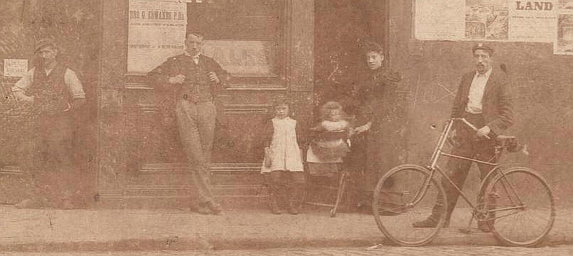 By the age of the children this picture was taken around April 1895. May Maud Amelia BULLEN was born 1.5.1888 so nearly 7, and Violet Victoria BULLEN on 1.5.1893 was nearly 2. Their third child, Ivy BULLEN was born 10.5.1895 - you can see Fanny Charlotte's baby bump! I assume the others in the photo are their employees with John BULLEN standing near the children. 