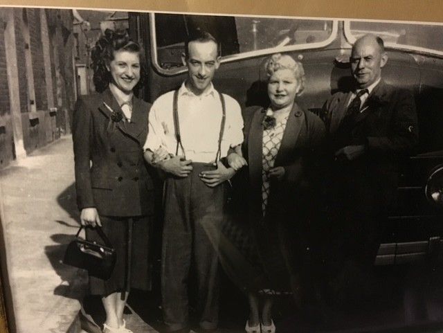 My mum and dad, Daphne and Len Bye on the left in front of coach