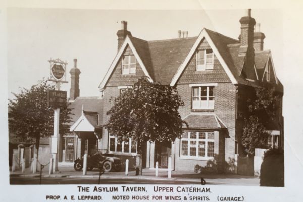 Asylum Tavern, Caterham with proprietor A E Leppard. Noted house for wines and spirits, (Garage)