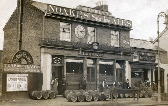 White Horse, 1 Selhurst Road, South Norwood SE25, with Landlord Job Longman, shown far right with his dog.
