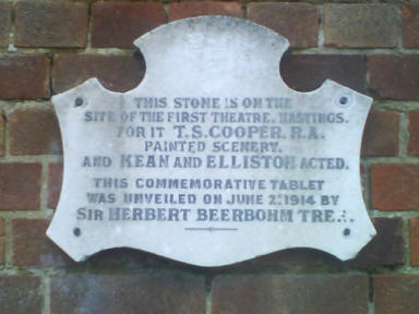 The plaque was first installed in a public shelter and moved to a nearby wall when the shelter was demolished in the 1970s. It's about 50 yards to the North of the pub on the other side of Saxon Road.
