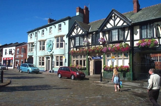 The Blackamoor Head Public House ( The half timbered building on the right) and the Green Dragon Public House next door. 29 August 2006